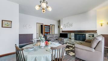 Family Villa, 3 Bedrooms, Balcony, Mountainside (Lago Azzurro Infinity View) | Living area | Flat-screen TV