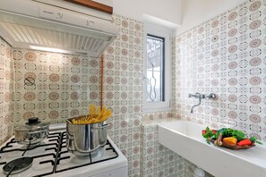 Family Villa, Multiple Bedrooms, Mountainside (Lago Azzurro Infinity View) | Private kitchen | Fridge, microwave, oven, stovetop
