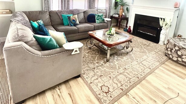 A living room with a sofa, coffee table, and fireplace. - Home away from home, 
 By university , hospitals ,  museum,
Pet friendly. (Cleveland)