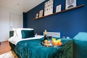 1 bedroom, desk, iron/ironing board, travel crib