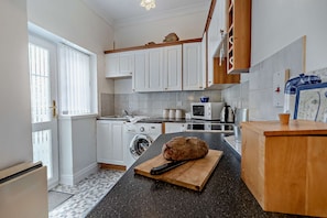 Fridge, oven, cookware/dishes/utensils