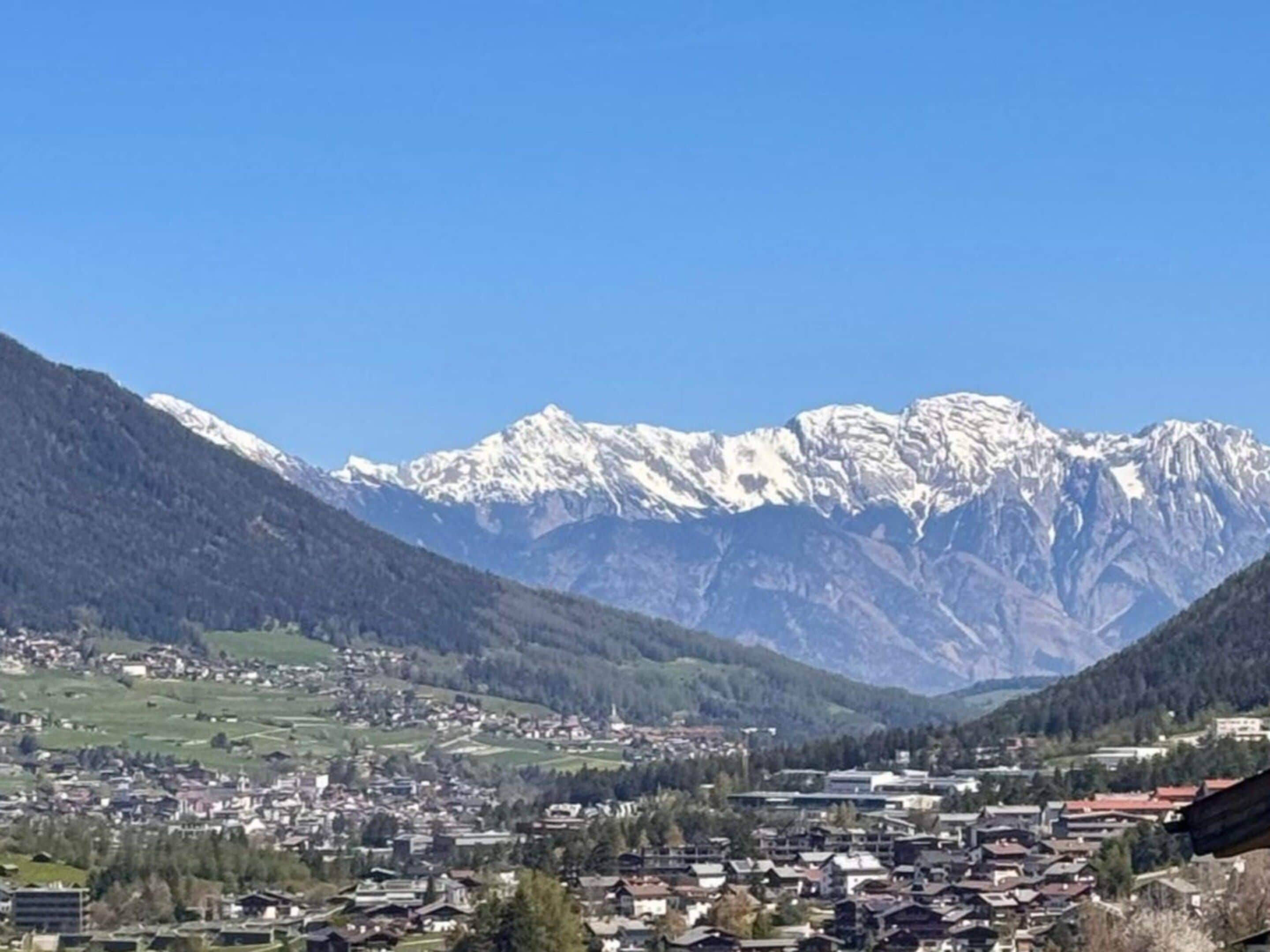 A mountainous landscape with a town nestled in the valley.