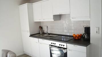 Apartment | Private kitchen | Oven, electric kettle, toaster