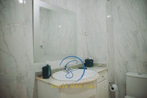 Hair dryer, bidet, towels, soap