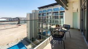 Room - Prime 1BR With Pool View Balcony at Masdar City (Abu Dhabi)
