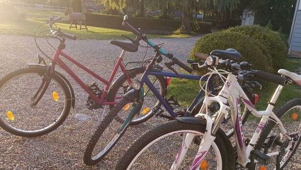 Three bicycles parked on a gravel path. - Northern Lights Modern Retreat (Steinberg)