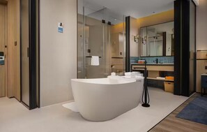 A modern bathroom with a freestanding bathtub, a glass shower enclosure, and a large mirror. - Four Points By Sheraton Chengdu, High-Tech Zone Exhibition Center (Chengdu)