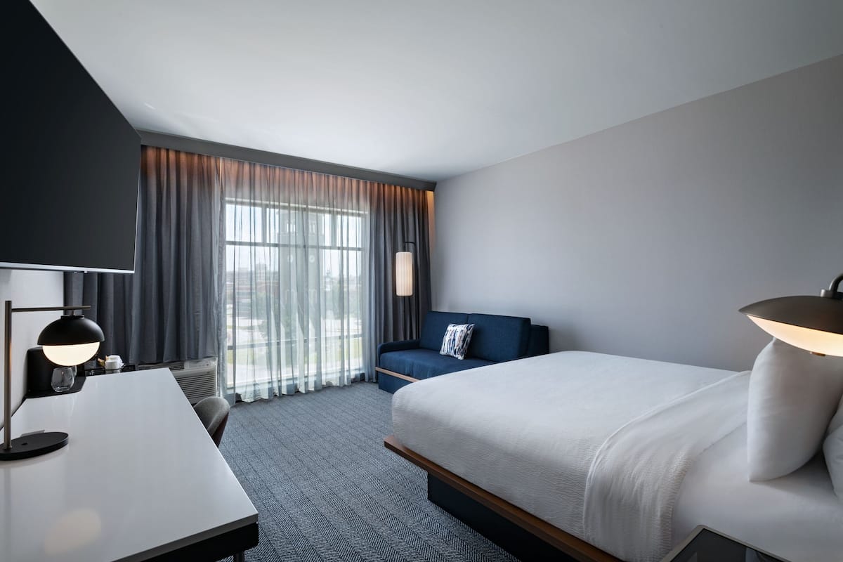 Premium bedding, blackout curtains, soundproofing, iron/ironing board