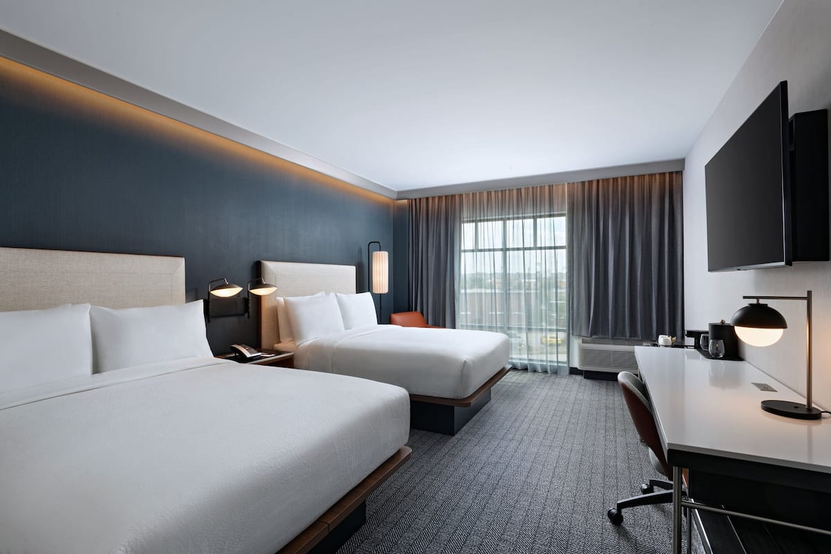 Premium bedding, blackout curtains, soundproofing, iron/ironing board