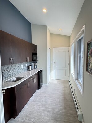 Microwave, coffee/tea maker, toaster, cookware/dishes/utensils