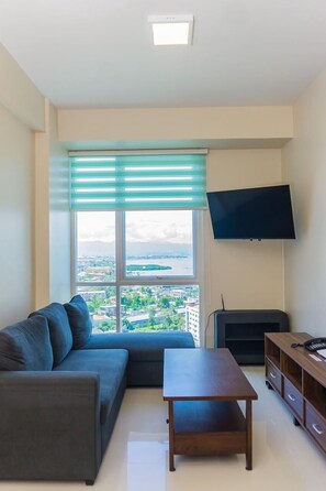 Deluxe Double Room, Balcony, Sea View | Living area | 45-inch Smart TV with satellite channels - Mactan Newton Condo with Pool Access (Lapu-Lapu)