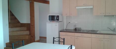 Fridge, microwave, stovetop, coffee/tea maker