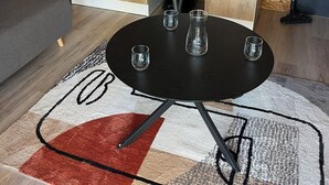 A compact kitchen with a built-in refrigerator, a sink, and a black countertop. - Cabane au Bord de L'eau (Saint-Pierre-Eynac)
