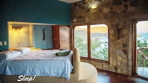 Une chambre à coucher avec un lit, une chaise, une fenêtre donnant sur un beau paysage et un mur en pierre.