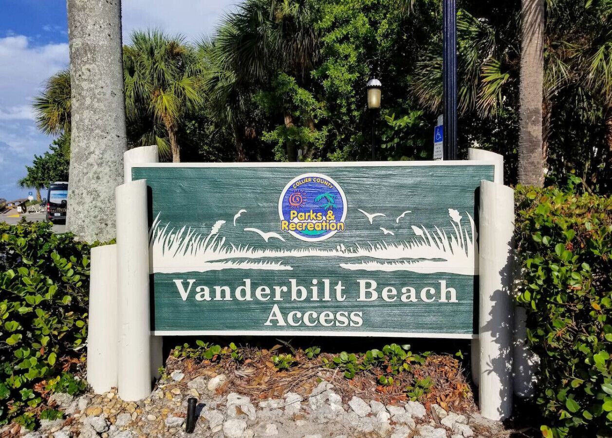 A sign for Vanderbilt Beach Access with a logo for Collier County Parks & Recreation.
