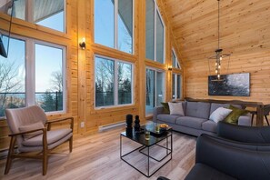 Relax in this inviting space with a comfortable sofa, armchair, and coffee table.