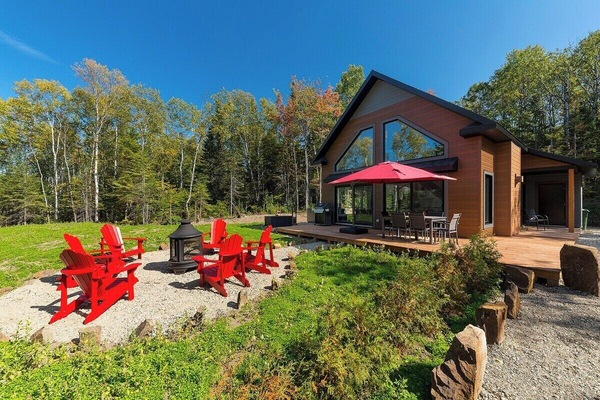 Sunny days and red chairs await! Relax on the deck.