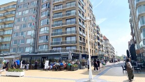 A modern apartment building with multiple balconies and large windows. - Apartment in Nieuwpoort by the Beach (Nieuwpoort)