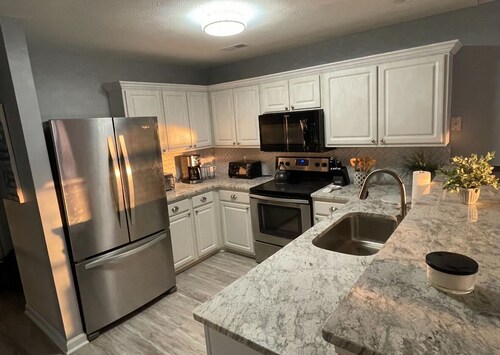 Newly renovated condo on True Blue's Signature Golf Course with water view.