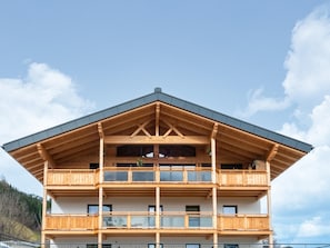A multi-story wooden building with balconies and large windows. - Apartment in Uderns Near Spieljoch Ski (Uderns)