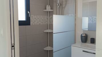 Shower, hair dryer, towels, toilet paper