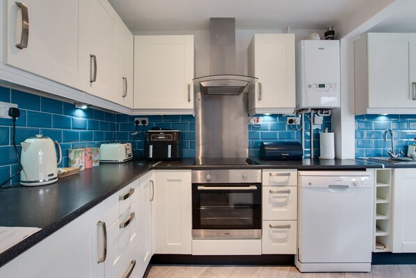 Fridge, microwave, oven, cookware/dishes/utensils