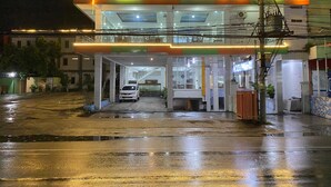 A hotel with a prominent sign reading "HOTEL WIJAYA" at night. - New Wijaya Hotel (Kalasan)
