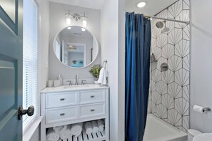 Hair dryer, towels, shampoo, toilet paper