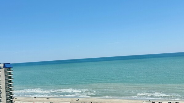 On the beach, sun loungers, beach towels