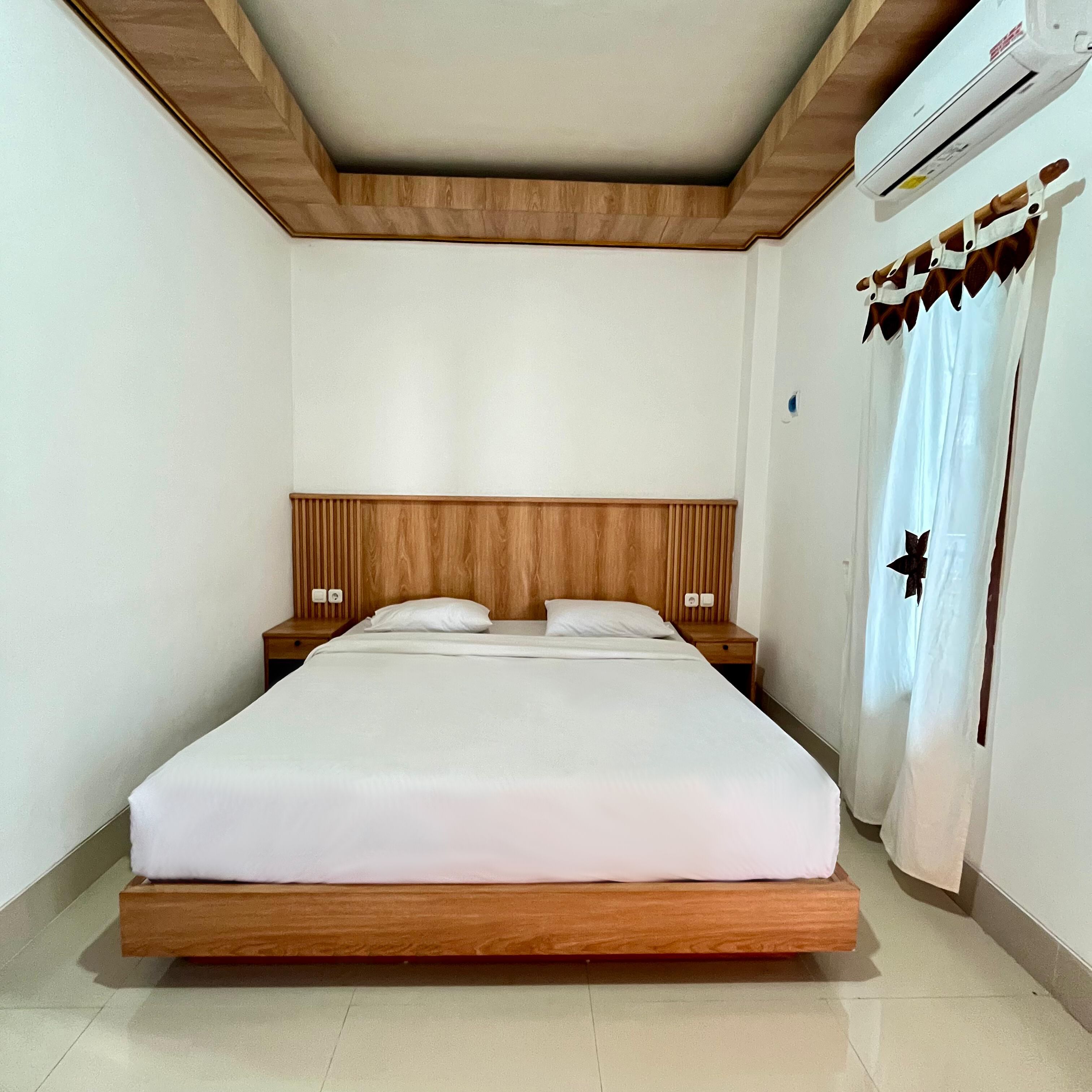 Premium bedding, desk, laptop workspace, blackout drapes