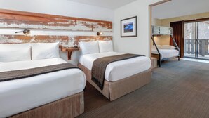 A hotel room with two beds, a wooden headboard, a framed picture on the wall, and a view through a large window. - Holiday Inn Express South Lake Tahoe by IHG (South Lake Tahoe)