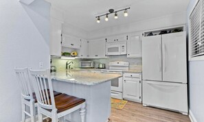 Fridge, microwave, oven, stovetop - Pelican’s Perch.Oceanfront 2 bedroom 2 bath .Pool (North Topsail)