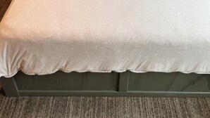 A bed with a grey headboard, white bedding, and two pillows. - 2 Bedroom Rental in Newport w/ Parking! Steps away from Thames, Broadway, & DT! (Newport)