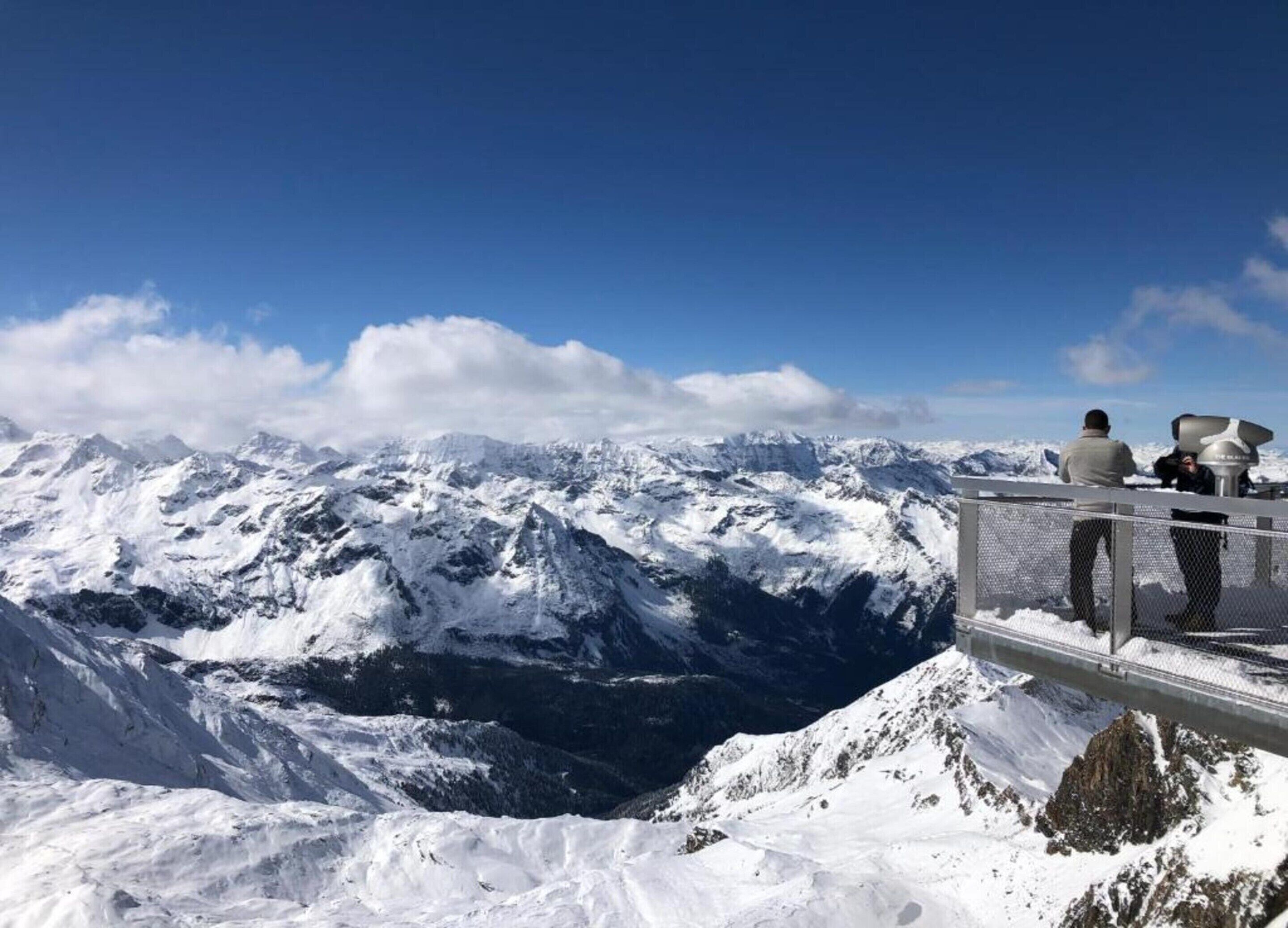 A snow-covered mountain landscape with a viewing platform.