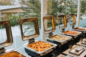 A buffet setup with multiple serving stations.
