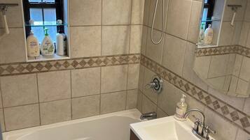 Jetted tub, hair dryer, towels, toilet paper