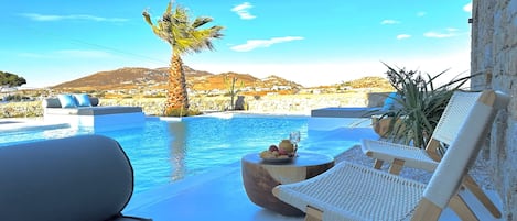 Seasonal outdoor pool, open 6:00 AM to 8:00 PM, pool loungers