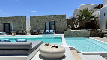 Seasonal outdoor pool, open 6:00 AM to 8:00 PM, pool loungers