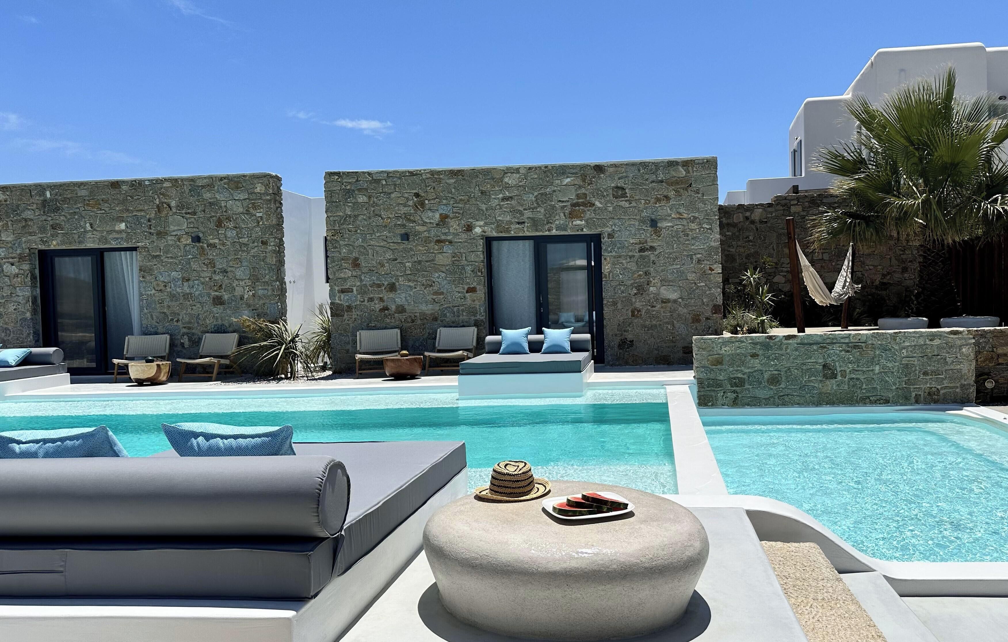 Seasonal outdoor pool, open 6:00 AM to 8:00 PM, pool umbrellas