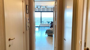 A hallway leading to a balcony with a view of the outdoors. - Apartment in Nieuwpoort by the Beach (Nieuwpoort)
