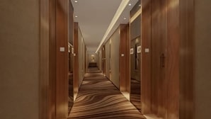 A corridor with wooden walls and doors, carpeted floor, and ceiling lights. - Tomorrow Wuzhou Hotel (Beijing West Railway Station Lize Business District) (Beijing)