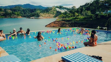Outdoor pool, open 10:00 AM to 11:00 PM, pool umbrellas, sun loungers
