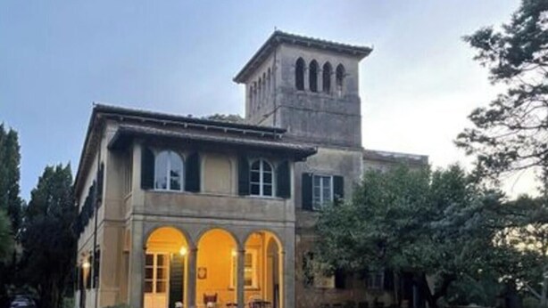 A large building with a central courtyard, arched windows, and a bell tower. - Beautiful Apartment in Tuscany (Casciana Terme Lari)