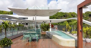 A rooftop deck with outdoor seating, a pool, and a covered area with a white canopy. - AX Setai Yacht (João Pessoa)