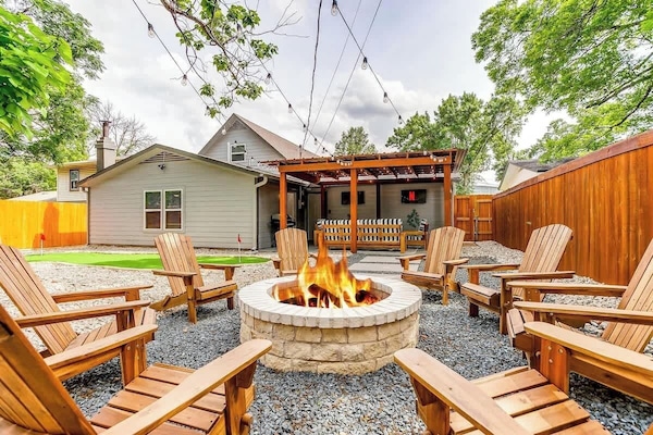 Relax in the backyard around the cozy fire pit, perfect for evenings of conversation & laughter. Enjoy the warmth of the fire, surrounded by comfortable Adirondack chairs & unwind under the stars. A great spot to create memories with family & friends