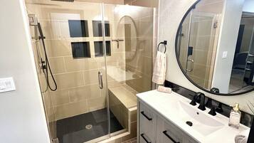 Shower, hair dryer, towels, toilet paper