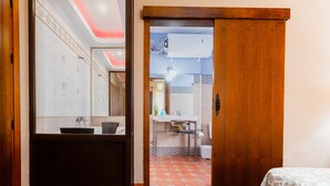 A bathroom with a sink, mirror, and shower area. - Holiday Home 'Esencia Del Paladin' with Mountain Views (Zufre)