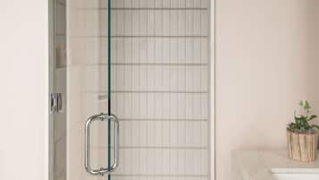 Shower, designer toiletries, hair dryer, bathrobes