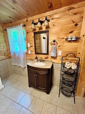 Shower, hair dryer, towels, toilet paper