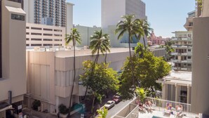 A high-rise building with a modern architectural design, featuring a prominent cylindrical tower and a flat-roofed structure with a grid of windows. - 💎LOCATION💎 5min to 🏄‍♀️🏊‍♀️🐠🦈🌸 free parking 🚙🅿️, fast WIFI💻 🌺F06A07🌺 (Honolulu)